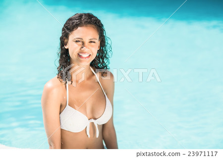 Portrait of beautiful woman in swimming pool Portrait of beautiful woman in swimming pool 23971117