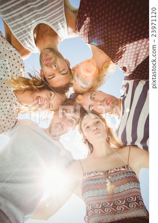 Group of friends forming a huddle 23971120