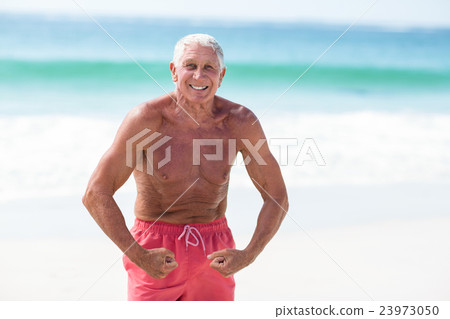 Handsome mature man showing his muscles 23973050