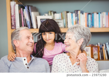 Happy granddaughter with grandparents 23973280