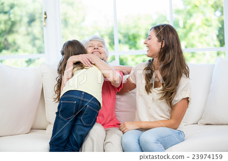 Senior woman hugging granddaughter 23974159