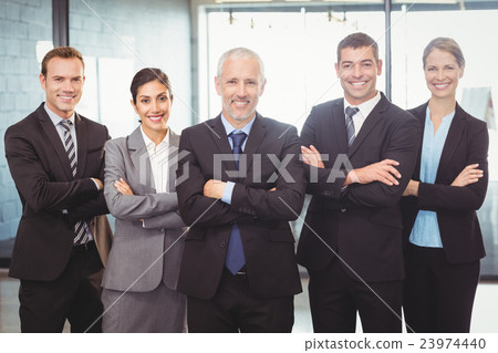 Businesspeople standing with arms crossed 23974440