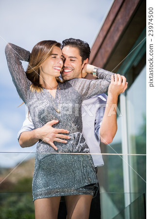 Happy romantic young couple embracing Happy romantic young couple embracing 23974500