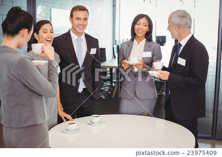Businesspeople having a discussion during breaktime 23975409