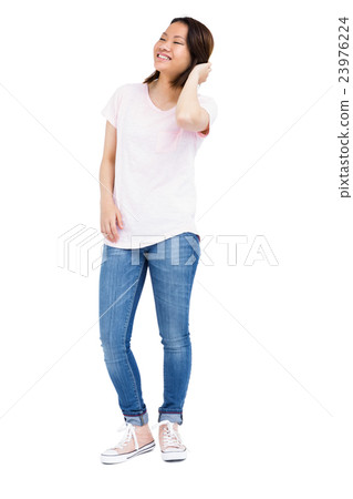 Cheerful young woman looking away and smiling 23976224