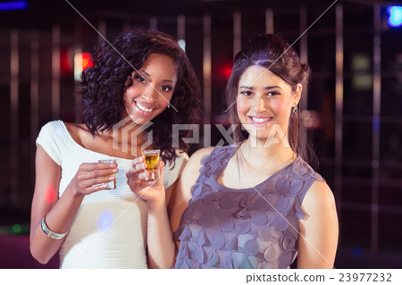 Pretty girls having shots Pretty girls having shots 23977232