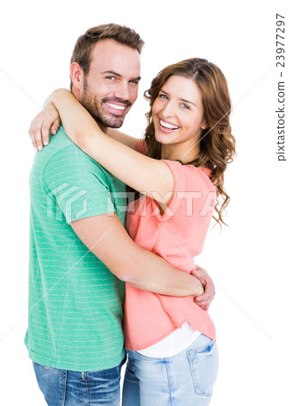 Happy young couple cuddling each other Happy young couple cuddling each other 23977297
