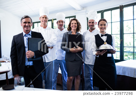 Happy restaurant team standing together in restaurant Happy restaurant team standing together in restaurant 23977298