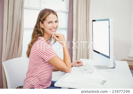 Happy beautiful woman using computer 23977299
