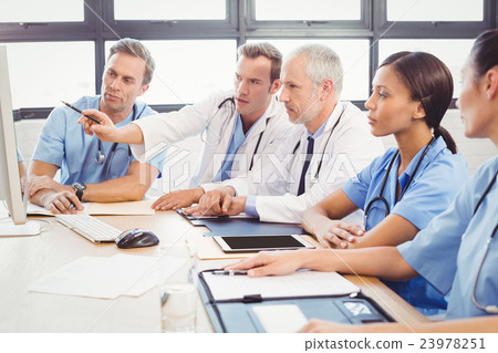 Medical team interacting in conference room Medical team interacting in conference room 23978251