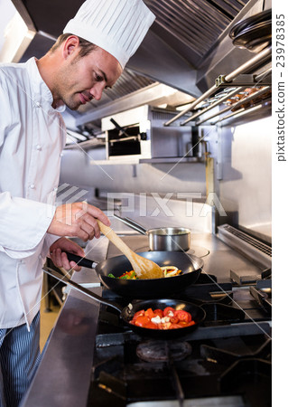 Chef preparing food in the kitchen 23978385
