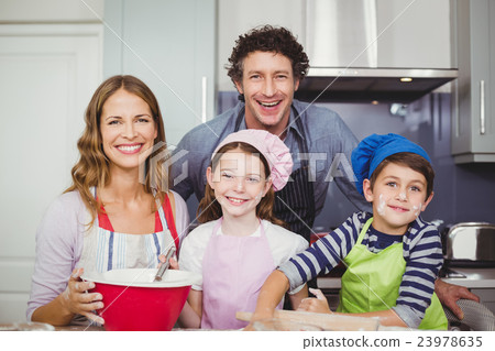 Portrait of happy family in kitchen 23978635