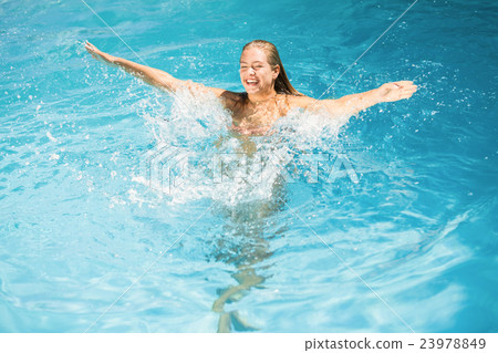 Beautiful woman enjoying in swimming pool Beautiful woman enjoying in swimming pool 23978849