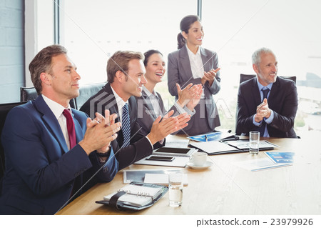 Businesspeople in conference room 23979926
