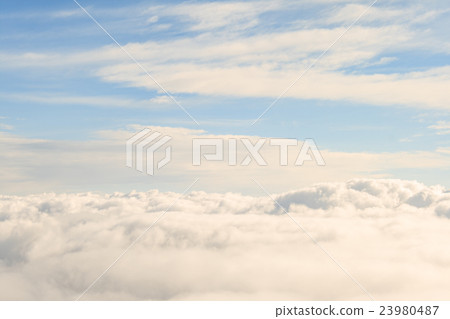 heavenly view high above the clouds 23980487