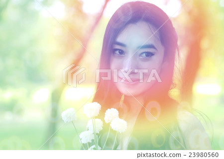 portrait of charming woman in garden 23980560