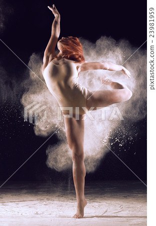 Dancer performing over black background with 23981959