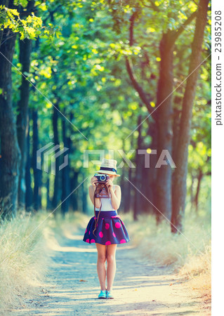 girl with camera girl with camera 23985208