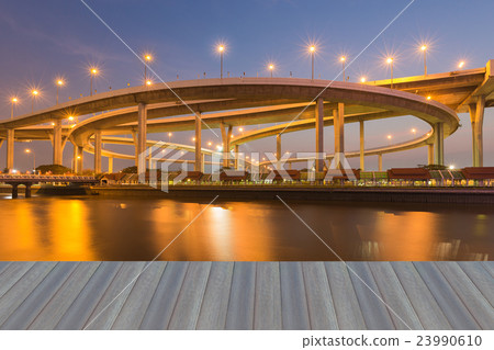 Twilight over Highway interchanged river front 23990610