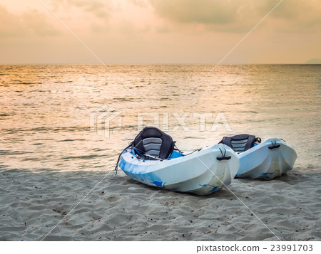 Kayaks on the tropical beach 23991703