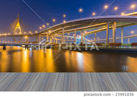 Twilight waterfront over highway interchange Twilight waterfront over highway interchange 23991836