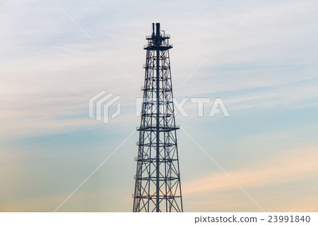 Oil refinery tower with natural blue sky Oil refinery tower with natural blue sky 23991840