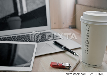 Office supplies with coffee cup, laptop in office Office supplies with coffee cup, laptop in office 24001600