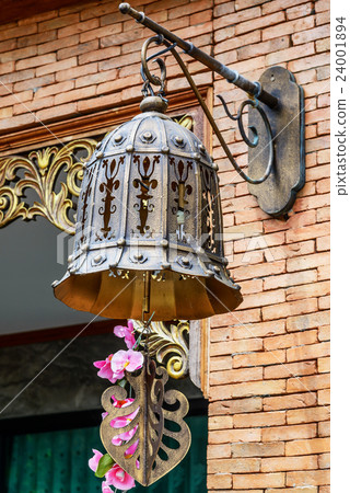 Street lamp hanging from a brick building. Street lamp hanging from a brick building. 24001894