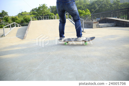 young kateboarder skateboarding at skatepark young kateboarder skateboarding at skatepark 24005706
