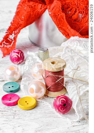 Thread,button and fabric 24006159