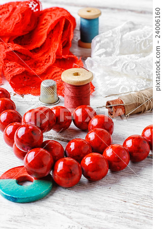 Thread,button and fabric 24006160