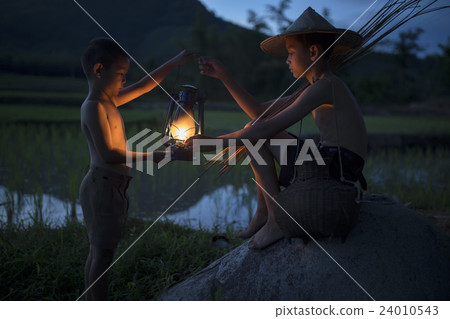 Two boys with lamp Two boys with lamp 24010543