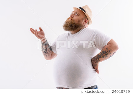 Fat guy thinking about something seriously Fat guy thinking about something seriously 24010739