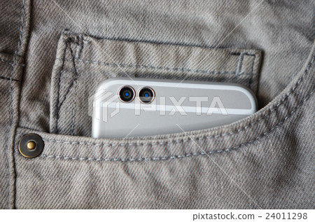 Modern dual camera smart phone in jeans pocket Modern dual camera smart phone in jeans pocket 24011298