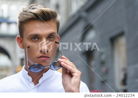 Attractive guy expressing his confidence 24012234