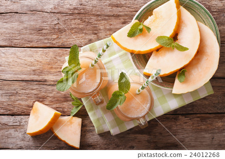 Honeydew melon juice closeup 24012268