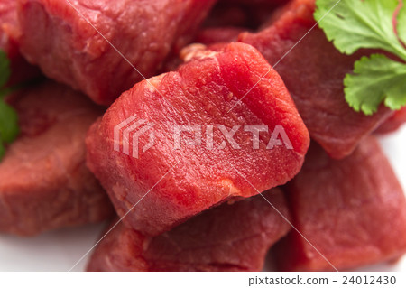 beef goulash raw as background, top view 24012430