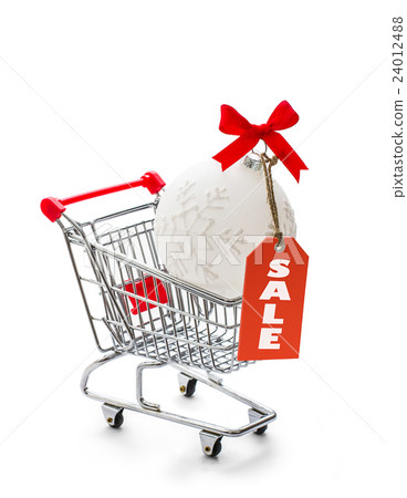 Shopping cart with big Christmas ball Shopping cart with big Christmas ball 24012488