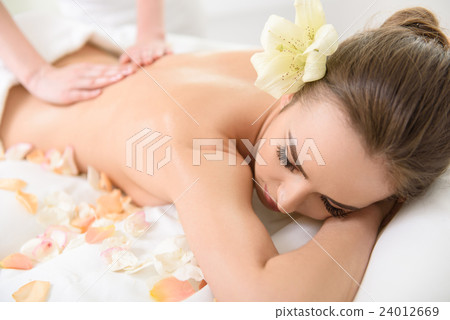 Cheerful girl resting at beauty salon 24012669