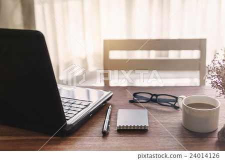 Laptop and cup of coffee with sunlight 24014126