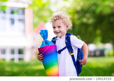 Little child with candy cone on first school day Little child with candy cone on first school day 24014729
