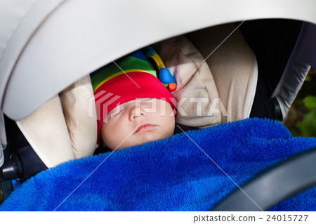 Baby sleeping in a stroller Baby sleeping in a stroller 24015727