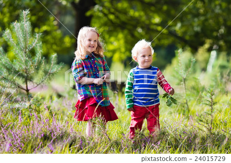 Kids playing in autumn park Kids playing in autumn park 24015729