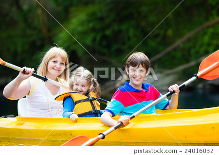 Family enjoying kayak ride on a river 24016032