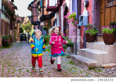 Children in historical city center in France 24016333