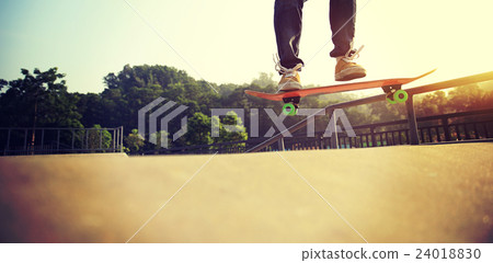 young skateboarder legs skateboarding at skatepark young skateboarder legs skateboarding at skatepark 24018830