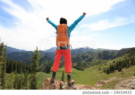 cheeringwoman backpacker open arms mountain peak cheeringwoman backpacker open arms mountain peak 24019435