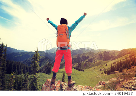 cheering successful woman backpacker open arms on mountain peak cheering successful woman backpacker open arms on mountain peak 24019437