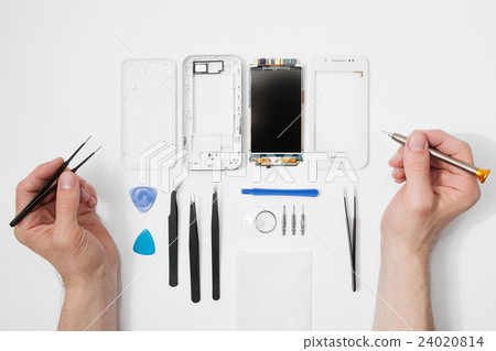 Repairman workplace with phone and tools 24020814