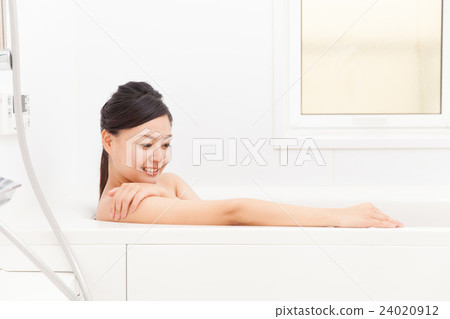 A woman taking a bath 24020912